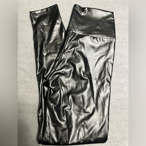 NWOT. faux leather leggings. never worn. size large.